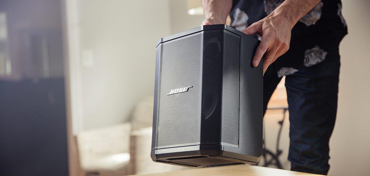 Men holding the S1 Pro Portable Speaker