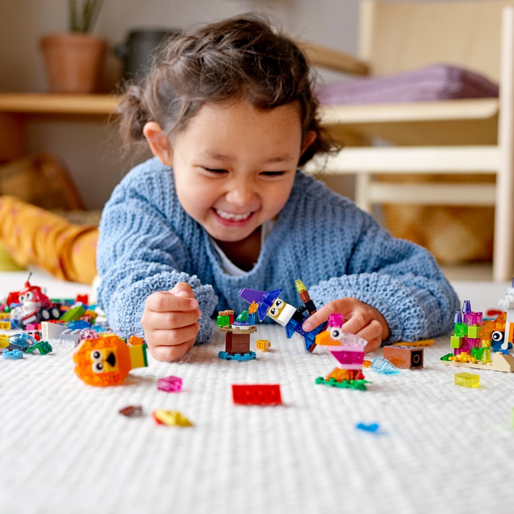 girl playing with classic lego game